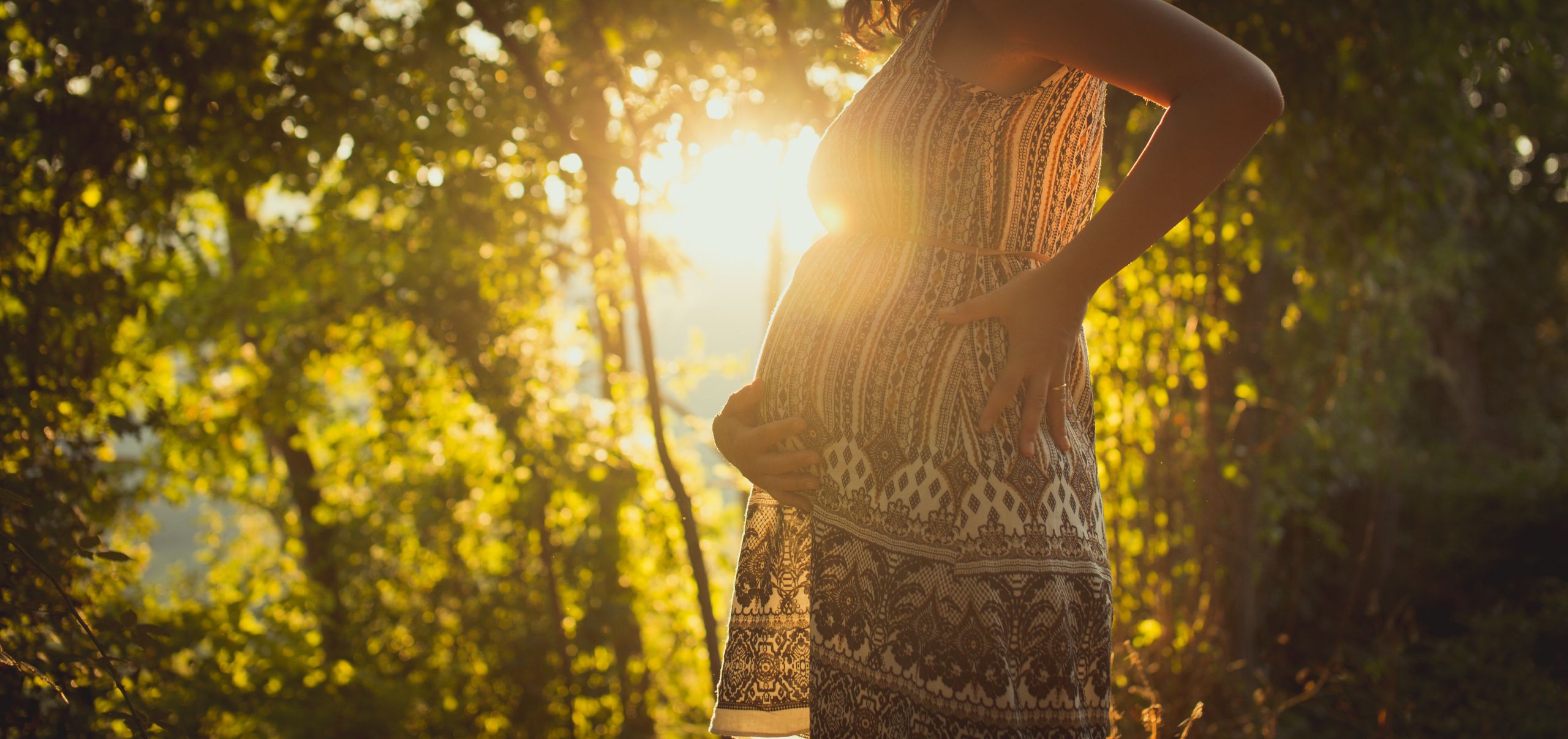 close-up-pregnant-woman-holding-her-belly